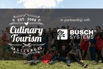 Culinary Tourism and Busch Systems logo in front of a group of people
