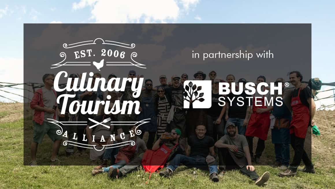 Culinary Tourism and Busch Systems logo in front of a group of people